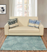 Modern geometric rug with overlapping circular pattern in teal